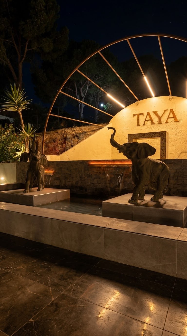 L’ingresso di TAYA illuminato di sera